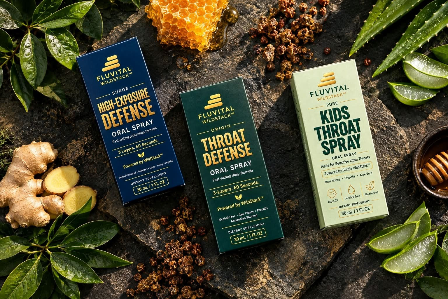 Fluvital SURGE, ORIGIN and PURE boxes with propolis, honeycomb, ginger and leaves on dark stone